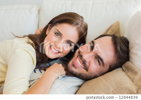 Cute couple relaxing on couch Cute couple relaxing on couch 12844839