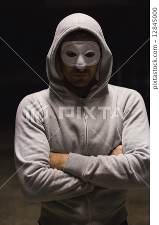 Criminal in mask looking at camera Criminal in mask looking at camera 12845000