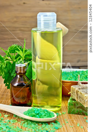 Shampoo and toiletries with nettles on board Shampoo and toiletries with nettles on board 12845404