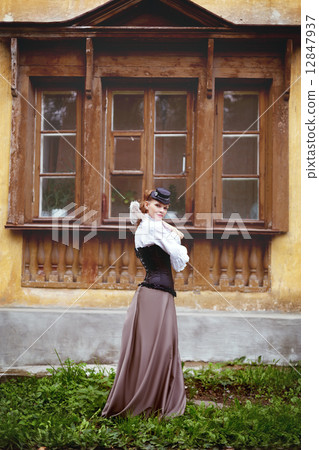 Beautiful redhair woman in vintage clothes 12847937