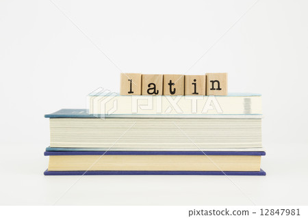 latin language word on wood stamps and books latin language word on wood stamps and books 12847981