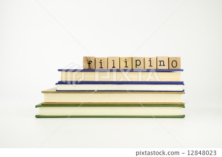 filipino language word on wood stamps and books 12848023
