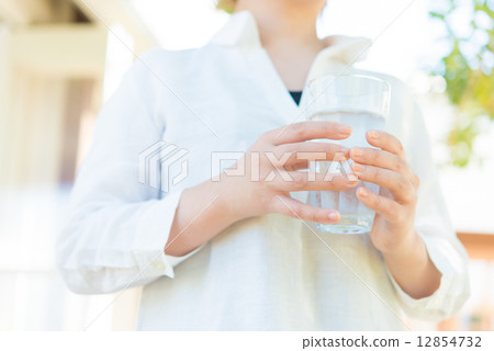 A woman drinking water 12854732