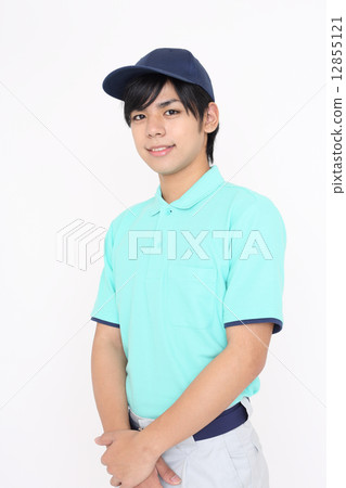 A young man wearing work clothes 12855121