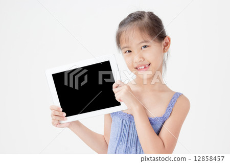 Happy Asian child showing tablet computer 12858457
