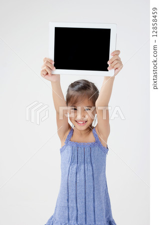 Happy Asian child showing tablet computer 12858459