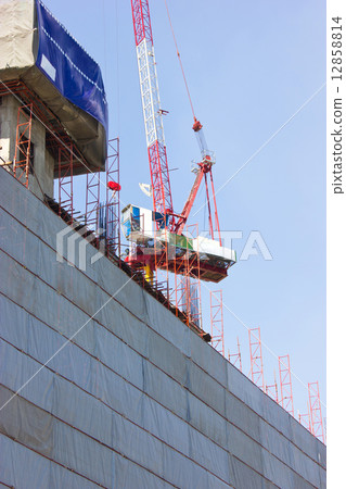 Construction site with crane and building. Construction site with crane and building. 12858814