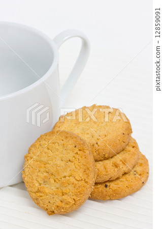Cookie with coffee cup. 12859091