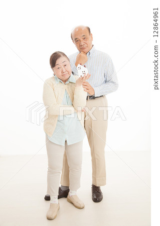 Senior couple and house 12864961