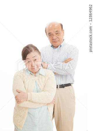 Senior couple and house 12864962