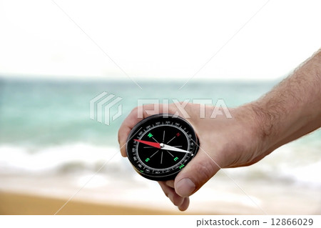Male hand with Compass 12866029