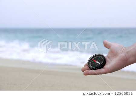 Male hand with Compass 12866031