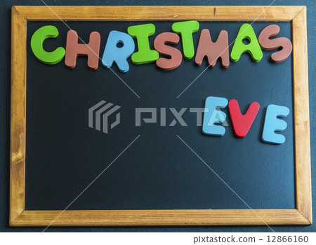Christmas eve day wooden word on black board1 Christmas eve day wooden word on black board1 12866160