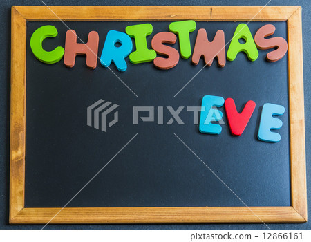 Christmas eve day wooden word on black board1 Christmas eve day wooden word on black board1 12866161