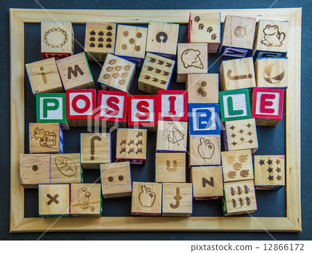 Colorful wooden word Impossible on blackboard 12866172