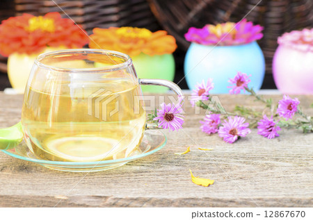 tea cup with different flowers on wood tea cup with different flowers on wood 12867670
