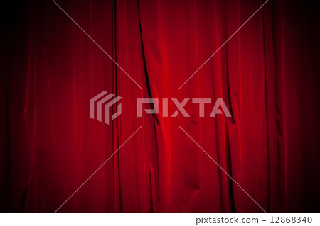 Curtain from the theater with a spotlight as background Curtain from the theater with a spotlight as background 12868340