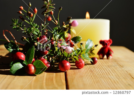 Arrangement of autumn fruit and candle and teddy bear Arrangement of autumn fruit and candle and teddy bear 12868797