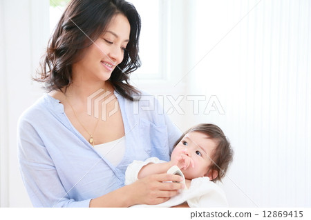 Mother measuring body temperature Mother measuring body temperature 12869415