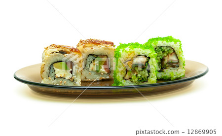 Japanese rolls on a plate isolated on white background close up. Japanese rolls on a plate isolated on white background close up. 12869905