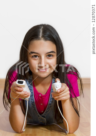 teenage girl playing video games teenage girl playing video games 12870371