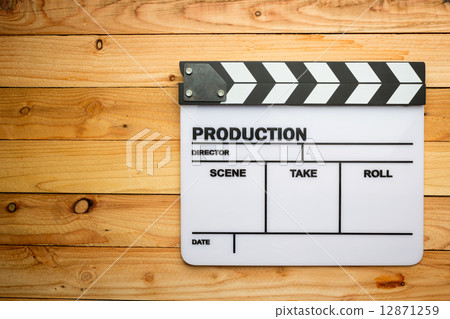 Movie slate film on wooden table 12871259