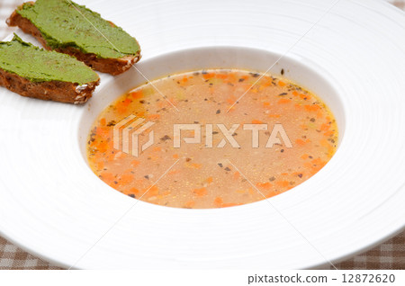 Italian minestrone soup with pesto crostini on side Italian minestrone soup with pesto crostini on side 12872620