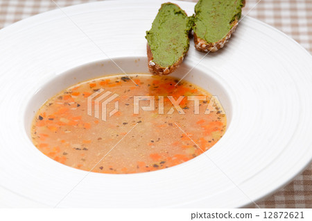 Italian minestrone soup with pesto crostini on side 12872621