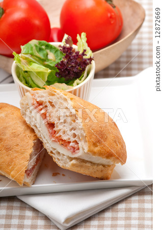 ciabatta panini sandwich with parma ham and tomato ciabatta panini sandwich with parma ham and tomato 12872669