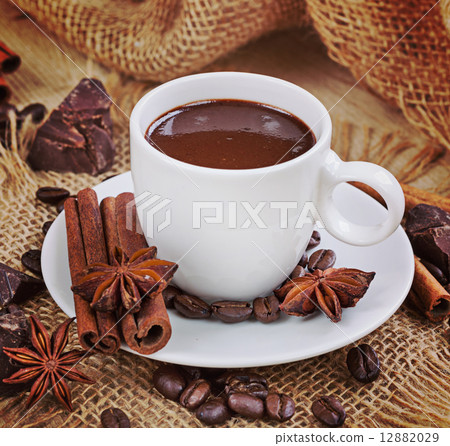 Hot chocolate, chocolate chips, cinnamon and star anise. Vintage Hot chocolate, chocolate chips, cinnamon and star anise. Vintage 12882029