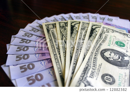 dollars and grivnas banknotes on the dark dollars and grivnas banknotes on the dark 12882382