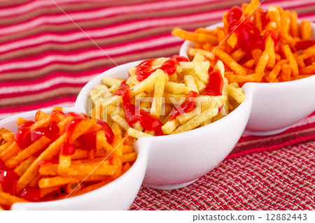 Potato chips with ketchup 12882443