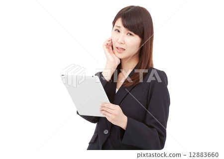 Business woman troubled with having a tablet Business woman troubled with having a tablet 12883660