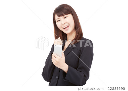 Business woman laughing with a smartphone Business woman laughing with a smartphone 12883690