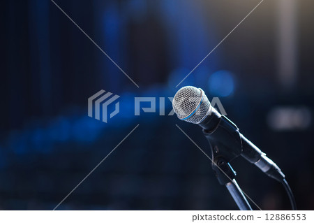 Close up of microphone in concert hall or conference room 12886553