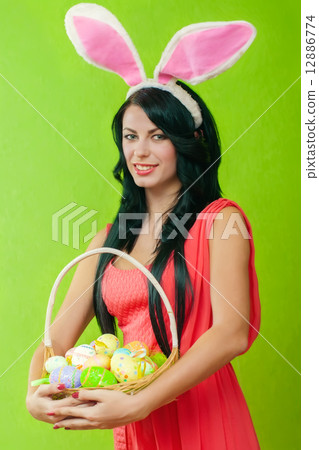 The beautiful girl with a basket of Easter eggs 12886774