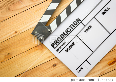 Movie slate film on wooden table 12887285