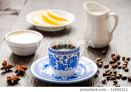 espresso in blue cup with lemon and honey on table espresso in blue cup with lemon and honey on table 12888321