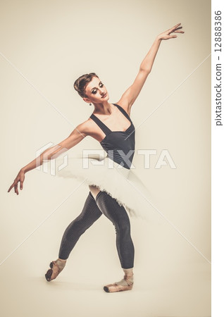 Young ballerina dancer in tutu showing her techniques Young ballerina dancer in tutu showing her techniques 12888386