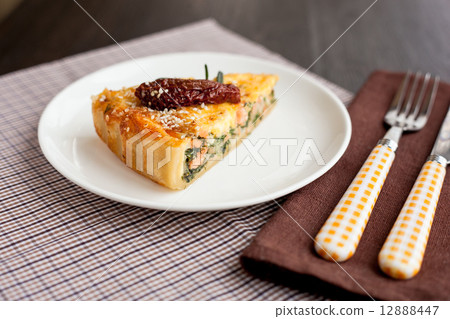 Piece of pie with spinach and fish salmon 12888447