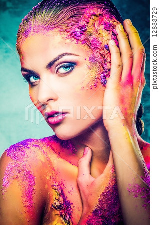 Beautiful young woman with conceptual colourful body art 12888729