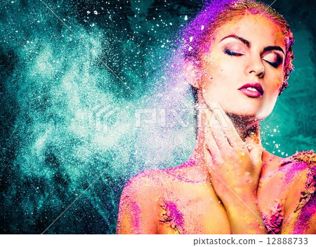 Beautiful young woman with conceptual colourful body art 12888733