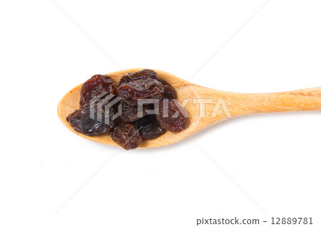 Raisin with wooden spoon isolated on white. 12889781