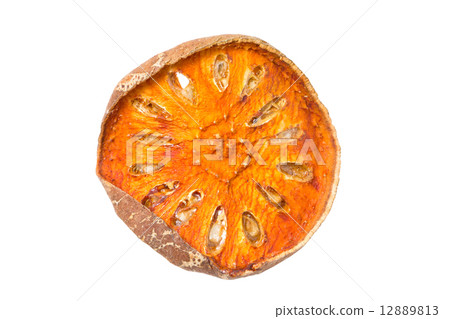 Slices of dried bael fruit isolated on white. 12889813