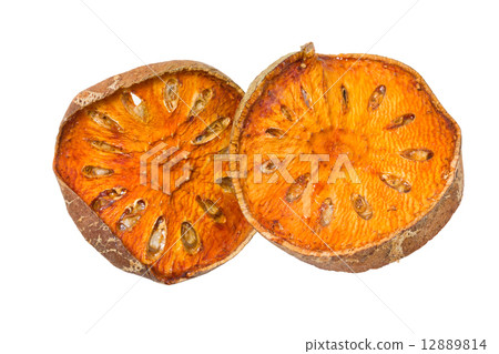 Slices of dried bael fruit isolated on white. 12889814