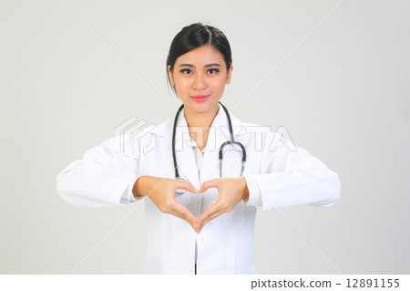 Asian female doctor with heart sign in chest  12891155