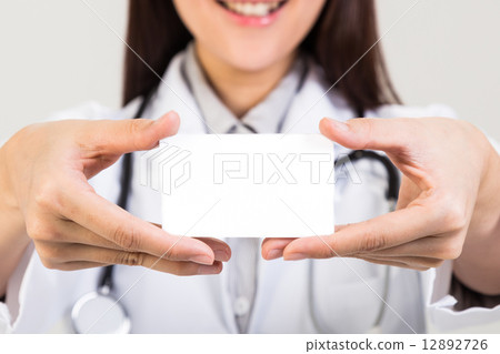 Female doctor holding blank placard Female doctor holding blank placard 12892726