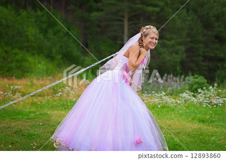 Bride pulls a steel chain Bride pulls a steel chain 12893860