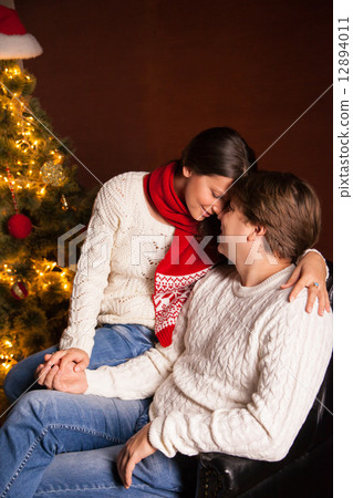 Happy Smiling Family at home celebrating New Year Happy Smiling Family at home celebrating New Year 12894011