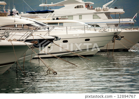 white luxury yachts and boats moored at sea harbor white luxury yachts and boats moored at sea harbor 12894767